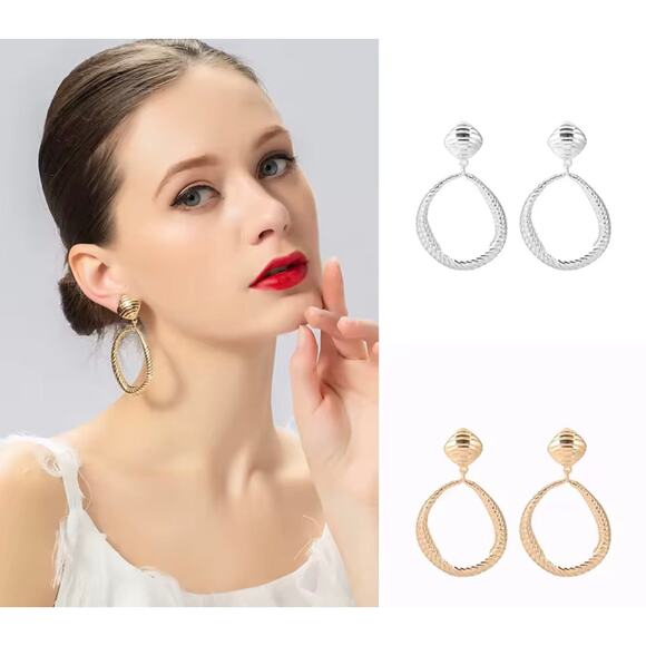 Clip on 2 3/4" large silver indented odd shaped hoop earrings - Picture 2 of 4